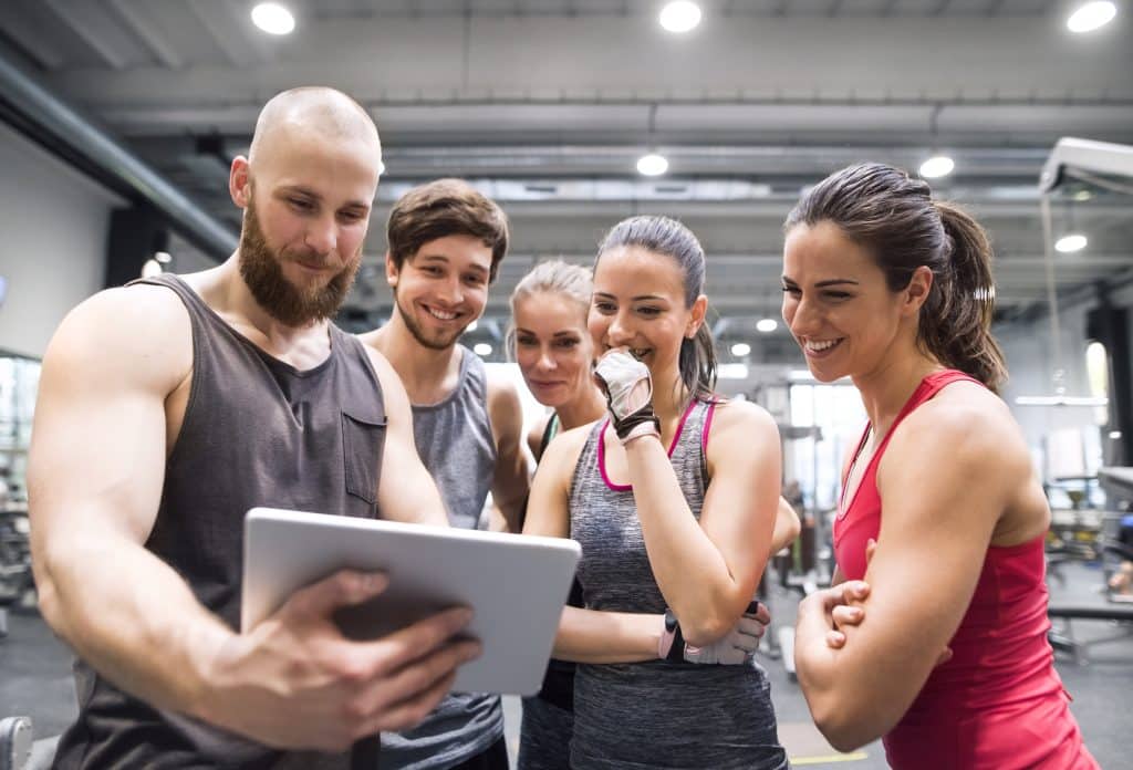 fitness enthusiasts reviewing metrics and performance analytics